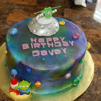 Buzz Lightyear Cake This was for my 4 year old nephew who adores Buzz Lightyear. It is a 10" WASCWC frosted with Sugarshacks buttercream. I airbrushed the...