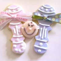 Baby Shower Cookies Made these for a friend's daughter's baby shower. Got the inspiration for the rattles from the Flower Pot Cookie Book, and the...