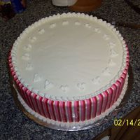 Valentine's Day Cake 12" Lemon essence cake with passion fruit jelly filling, SMBC with red and pink fondant stripes. (foil is causing shiny spot on front...