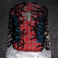 Spiderman Vs. Venom Birthday cake. Carved bust of Spiderman with black representing Venom. Vanilla bean and chocolate marble cake with vanilla and chocolate BC...