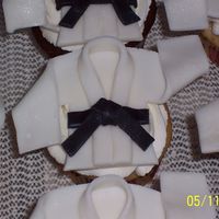 Karate Gi Cupcakes Fondant Gi with black belt on vanilla and chocolate cupcakes with vanilla BC. Inspiration from other CC'ers and DD judo Gi.