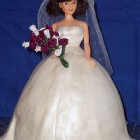 Wedding Shower Cake Wedding shower cake for best friend. Carved 8" rounds to make skirt. Vanilla bean cake with strawberry cheesecake filling, iced in...