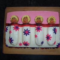 Sleepover Cake Yellow sheet cake with twinkie bodies, covered in BC with fondant accents