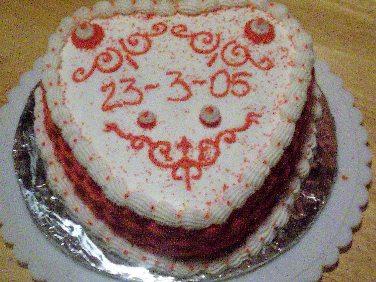 Work_Cake.jpg I made this cake for co-workers. This was just thrown together at the last minute. It is yellow homemade cake with strawberry filling....