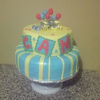 1St Birthday Birthday Cake made for a first birthday. Chocolate cake with layers of fudge and Vanilla cake with strawberries. Covered in buttercream and...