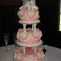 Tamula's Wedding Cake 6-8-10" rounds. The bride found a pic of this cake at Walmart and asked me to make it. It took a TON of buttercream frosting... dyed...