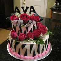 Baby Ava's Cake Zebra Stripes with pink accents and pink roses. 6"-10" round stacked offset. Icing is buttercream. Zebra stripes are fondant. 2&...