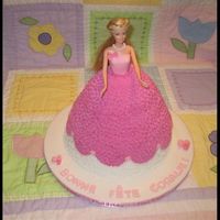 Barbie Cake Letters, dress top, necklace, and flowers are marshmallow fondand. The rest is buttercream.