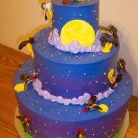 Firefly Cake Idea from the Whimsical Bakehouse book. Fireflies are gumpaste cut with a cookie cutter I found and painted with food coloring.