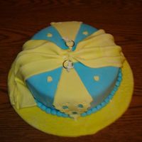 Kriss' Bridal Show This is a lemon cake filled with buttercream icing done for a co-worker's bridal shower. The cake & cake plate are covered in...