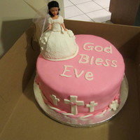 1St Communion Cake Communion cake with communion girl on top. Her dress is made of cake. Covered in fondant w/ fondant accents.