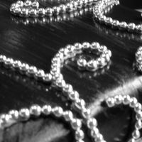 Black And Silver Scrolls Close-up, Black fondant, scrolls in silver dragees.