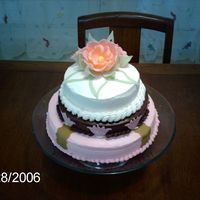 Art Deco-Ish Birthday Cake Bottom layer is a pastel pink, second layer is brown with pink art-deco tulip cut-put and top is a very pale pink with handmade fondant...