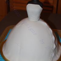 Bridal Gown Copy of bridal gown - bodice was done in gumpaste, skirt was vanilla cake covered in fondant. Excuse the lovely blue non-skid mat under the...