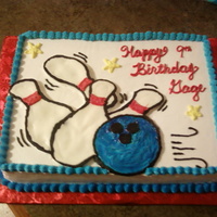 Bowling Buttercream transfer with yellow cake and choc. filling. The icing is vanilla whipped