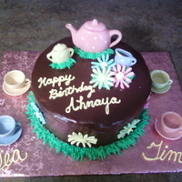 Tea Time Birthday Cake Chocolate cake with fudge poured on top.