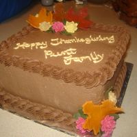 Square Chocolate Buttercream Buttercream icing with fondant leaves and royal flowers.