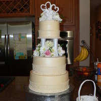 Champagne Wedding Cake.. I made this cake for my sister in-laws wedding.. White cake with lemon filling covered in buttercream.. It was GOOOOD..