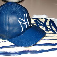 New York Yankees Father's Day Cake The hat is lemon cake with lemon icing covered in fondant. The bill of the hat is gumpaste. The sheet cake is half red velvet and half...