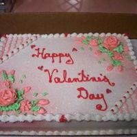 Vday2.jpg White cake with all buttercream decorations . The corners were lightly airbrushed with red and the red hearts were done with candy melts.
