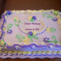 Daisy Birthday Cake White almond sour cream 1/2 sheet cake with buttercream icing and fondant decorations.