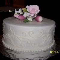 Butter Cream Dots/scrolls Butter cream practice cake. Used Wilton scroll impression kit (pushed too hard). Purchased gumpaste topper (I'm taking the gumpaste...