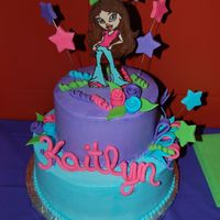 Bratz My second stacked cake, 12" yellow 8" chocolate with SugarShack's buttercream for my dd's 10th birthday. Bratz is a...