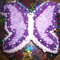Butterfly not quiet 3-d but its a butterfly how 3-d can you be. made from 10 inch round cut in half and butted together. butter cream with large star...