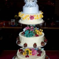 Cd_File1_0683.jpg This is a cake I did for my brothers wedding. The place where we had the reception messed it up a bit, but I was somewhat able to fix it.