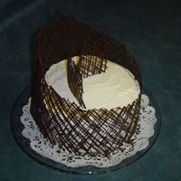 Chocolate Lattice chocolate lattice band, whipped cream frosting on a chocolate cake