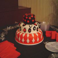 Graduation Fondant cake. top layer was strawberry with strawberry filling, middle was white chocolate with crushed almond amaretto filling, bottom was...