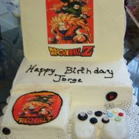 Xbox Birthday Cake The screen is made of white chocolate with the photo and the control is mde of cake as well