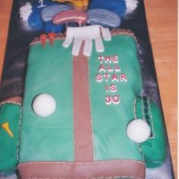 Golfbag Cake Carved cake, covered with fondant - clubs, balls, accessories made from fondant. Fun cake to do and the person loved it!