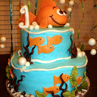 Goldfish Cake Goldfish cake for baby's first birthday. Chocolate with cookies and cream filling and lime with raspberry filling. Buttercream with...
