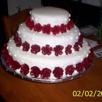 My First Wedding Cake-70 Gumpaste Roses This is my first attempt at a wedding cake. Three stacked tiers, buttercream icing covered with fondant, 70 gumpaste roses that I had to...