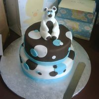 Baby Shower Cake 6" round and 10" round cake with chocolate fondant and white chocolate fondant. Bear is made out of fondant as well.