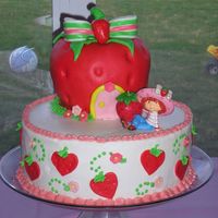 Strawberry Shortcake My daughters 4th birthday cake! The strawberry is made of rice krispy treats covered in mmf. 10" cake is buttercream with fondant...