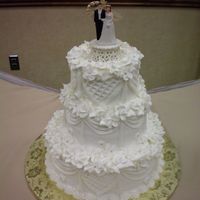 100_0020.jpg Made to resemble the couple's original wedding cake. All Buttercream