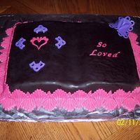 Valentine's Day Cake For Church 2007--"so Loved" Book cake (tangerine) covered with chocolate MMF with pina colada MMF accents. It had lots of flaws because I was just making it to...
