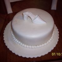 Jaime's Bridal Shower--Bridal Shoe Cake 10" round covered with buttercream and fondant, lightly dusted with pearl dust. The shoe was made using the pattern linked to the...
