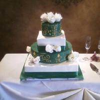 Wedding Cake Wedding cake for a friend. The icing is actually white chocolate ganache that I colored green. Details are done in gold and we used natural...