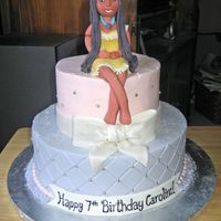 Pocahontas Frosted in buttercream with fondant bow and fondant pocahontas. This was an unusual cake because the birthday girl wanted a pale pink and...