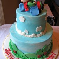 Airplane Frosted in buttercream with fondant accents. All the credit for the idea of the plane and boy goes to bmote1!