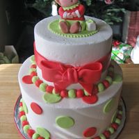 Christmas Elf Buttercream with fondant accents. Elf sculpted from fondant. I had a lot of inspiration from other elf cakes on this site!