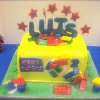 Lego/ Mega Blocks Cake This cake is made to look like the child's Mega Blocks Toy Chest. Covered in Fondant, Fondant Legos, Gumpaste Name and Stars.