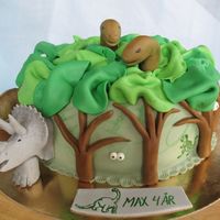 Dino Cake This cake is for Max. I had a lot of fun making it. I think I filled the sponge cake with caramel mousse and banana whipped cream. All...