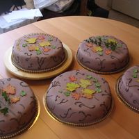 Fall Wedding Cake Vanilla sponge cake filled with raspberry mousse and dark chocolate ganach. Covered in chocolate sugar paste. I made all the leafs and text...