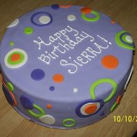 Birthday Cake Covered in fondant with fondant circles.