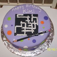 Crossword Puzzle Crossword puzzle and pencil made with fondant, cake also covered in fondant.