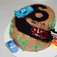 Cars Cake Cars cake I made for my sons 6th birthday, the cars on top were part of his gift.